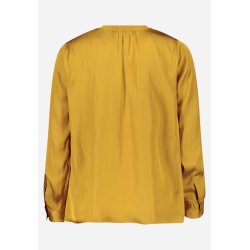 Bagsiden af den ensfarvede gule bluse med lange �rmer.