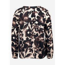 Bagsiden af den brune m�nstrede bluse med lange �rmer.